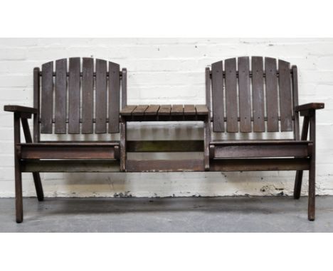 Slatted garden bench, two seats with a table centre.