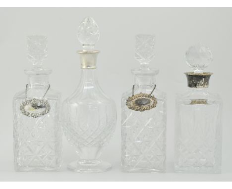 Pair of cut glass decanters, with hallmarked silver decanter labels, Sherry and Scotch, a hallmarked silver rimmed decanter a