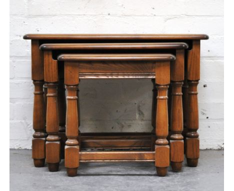 Ercol nest of tables, height 43cm, width 62cm, depth 43cm.