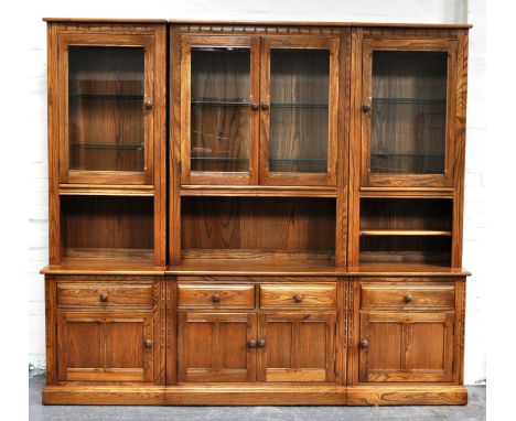 Ercol three sectional dresser, four glazed doors, height 200cm, width 217cm, depth 50cm.