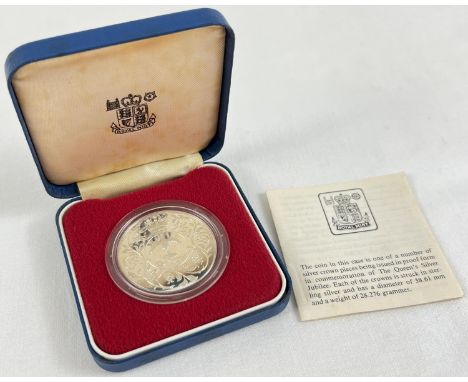 A 1977 silver proof The Queen's Silver Jubilee Commemorative Crown. In original plastic protection case and box. Complete wit