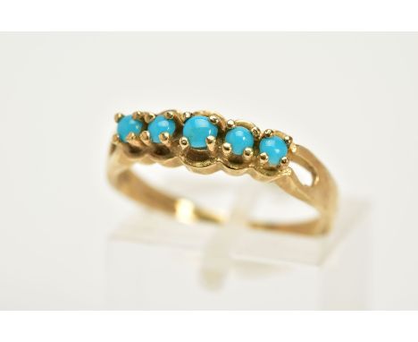 A 9CT GOLD FIVE STONE RING, set with five graduated cabochon turquoise bifurcated shoulders, plain polished band hallmarked 9