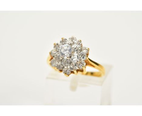 A CUBIC ZIRCONIA ROUND CLUSTER RING, ring size K, unmarked tested as approximately 18ct-22ct gold, approximate gross weight 4