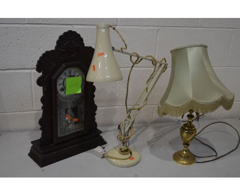 A CREAM PAINTED ANGLE POISE DESK LAMP, together with an early to mid 20th century oak mantel clock, a brass table lamp and an