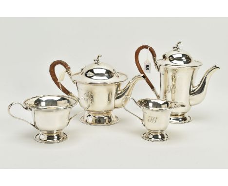 A SILVER FOUR PIECE TEA SERVICE SET, to include a silver teapot with wicker handle, a matching coffee pot, a creamer and a do