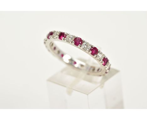 A MODERN RUBY AND DIAMOND FULL ETERNITY RING, estimated total diamond weight 0.84ct, colour assessed as F-G, clarity assessed