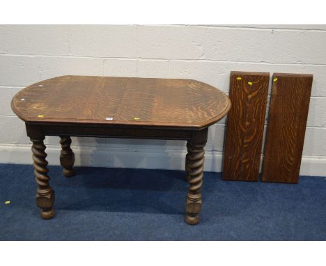 A SMALL EARLY 20TH CENTURY OAK BARLEY TWIST WIND OUT DINING TABLE with two additional leaves, extended length 180cm x closed 