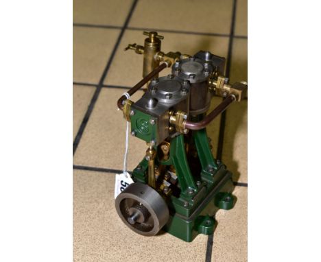 A STUART TURNER DIO VERTICAL TWO CYLINDER LIVE STEAM MARINE ENGINE, not tested, appears largely complete and in very lightly 