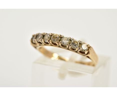 A 9CT GOLD HALF HOOP RING, designed with seven claw set, circular cut cubic zirconia, hallmarked 9ct gold Edinburgh, ring siz