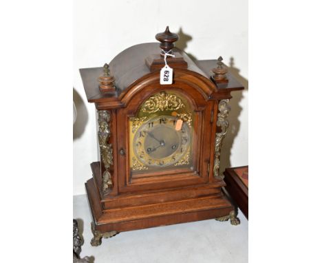 A LATE 19TH CENTURY WALNUT CASED BRACKET CLOCK, domed top with turned wooden finials, gilt metal mounts to sides, brass dial 