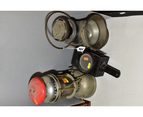 A LUCAS KING OF THE ROAD VEHICLE OIL LAMP, black body with brass trim fixed handle, clear lens to front, small red lens to re