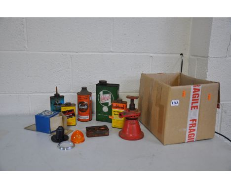 A COLLECTION OF VINTAGE OIL CANS, a bottle jack and an Austin Rover indicator lamp (8)