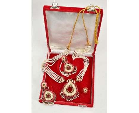 AN ASIAN SUITE OF JEWELLERY, to include a long fancy necklace, ear pendants and ring, each piece intricately decorated with r