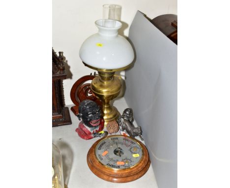 A GROUP OF COLLECTABLES, including a 20th Century circular barometer, a painted aluminium Jolly money bank, a New Zealand woo