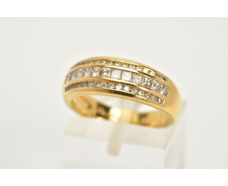 AN 18CT GOLD DIAMOND TRIPLE BAND RING, designed with a central row of channel set princess cut diamonds, between two rows of 