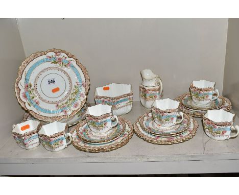 A LATE VICTORIAN PART TEA SERVICE comprising six each of teacups, saucers, side plates, milk jug, slops bowl and two sandwich