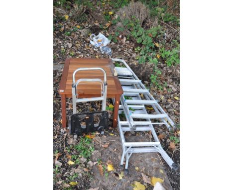 A MODERN TEAK GARDEN OCCASIONAL TABLE, a folding aluminium sack truck and two aluminium step ladders (4)