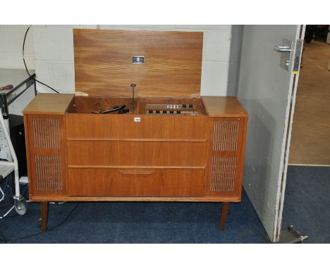 A DYNATRON 12/10 TRANSPOWER RADIOGRAM in teak case (lid broken) with a Garrard turntable, tuner (tuning control inoperable), 