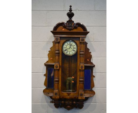 GISTAV BECKER, A LATE VICTORIAN WALNUT VIENNA WALL CLOCK, the glass door enclosing an enamel 6 1/2 inch dial with roman numer