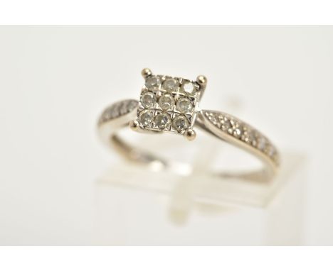 A WHITE METAL DIAMOND RING, the square central panel set with nine round brilliant cut diamonds, to the single cut diamond de