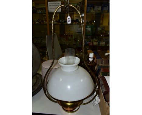 A BRASS HANGING LANTERN WITH WHITE OPAQUE SHADE, with a pair of lobed pink shades, a hanging pierced brass globe shade with h