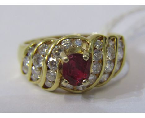 18ct YELLOW GOLD RUBY &amp; DIAMOND RING, principal oval cut ruby in 4 claw setting, surrounded by a swirl cluster of bright 