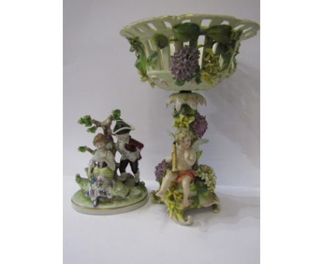 CONTINENTAL PORCELAIN, a floral encrusted amorini based centre piece; together with Sitzendorf figure group, "The Letter", 18