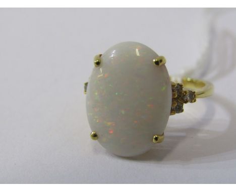 18ct YELLOW GOLD OPAL &amp; DIAMOND RING, principal oval cut opal with good spectrum of colour, 3 accent diamonds to each sho