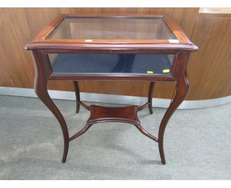 TREASURE TABLE, mahogany serpentine topped treasure table on French cabiole legs and shelf base, 59cm width 