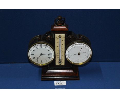 A combination barometer/ thermometer desk clock with key, 9" tall.