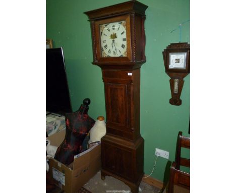 An Oak and Mahogany cased Longcase / grandfather clock having light and dark-wood stringing, the painted face with Roman nume