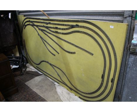 A "OO/HO" gauge model railway Layout, the triple track layout with points and sidings mounted on base board, 96'' x 48'' appr
