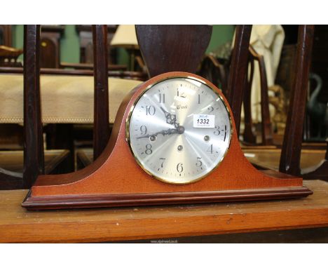 A Hermle 'Napoleon Hat' Mantle clock, with key, 19 3/4'' wide overall.