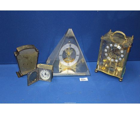 Four clocks including; Acctim carriage clock, Smiths sectric mantle clock, miniature clock in brass bible shaped case having 