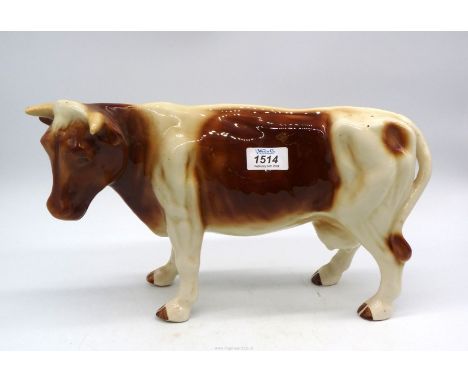 A large china model of a Dairy Cow (no marks) 15" x 8 1/2" high.