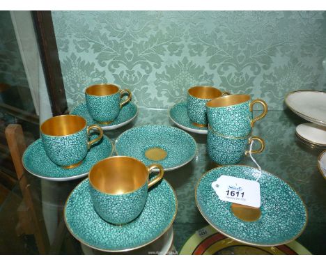 Six Royal Worcester coffee cups and saucers decorated in a blue/green pebble pattern having gilt interior and edging - chip t
