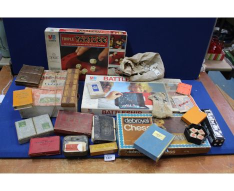 A quantity of board and playing card Games including Chad Valley 'Poker Dice', Waddingtons' and Harrod's playing cards, Battl