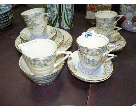 A 1920's Art Deco Phoenix ware viola pattern tea set comprising 21 pieces to include cake plate, milk jug, and sugar basin.