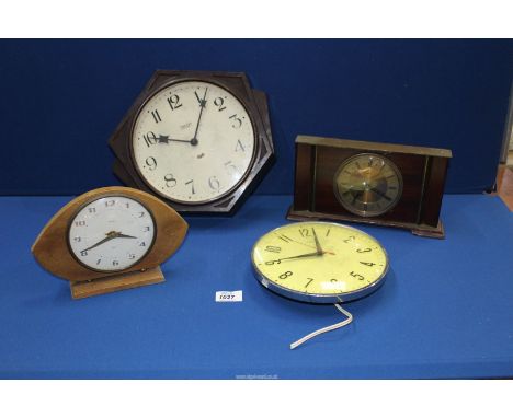 Four clocks including; Smith electric wall clock in Bakelite frame, Metamec mantle clock, etc.