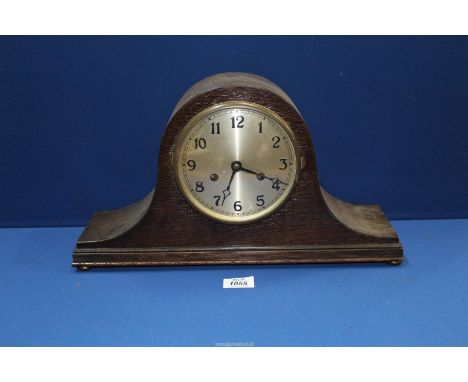A Napolean hat shaped mantle Clock having Arabic numerals, 17" wide x 9 1/2" high.