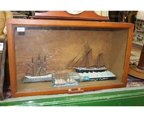 A homemade display case with glazed front and lift-up lid, containing two model ships and a ship in a bottle, 31" wide x 10" 
