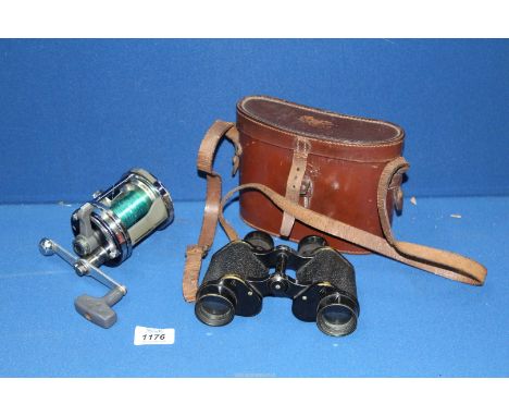 A pair of WWII British binoculars by A. Kershaw & Sons, together with an ABU Garcia Ambassadeur 7000 fishing reel.