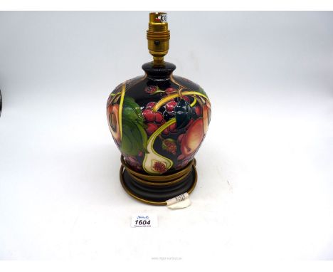 A Moorcroft 'Queens Choice' pattern table lamp in baluster form, 10 1/2" tall.