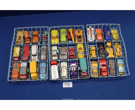 Three trays of toy vehicles including; Matchbox Hovercraft, Corgi Juniors Formula 1 racing car, Batmobile, etc.