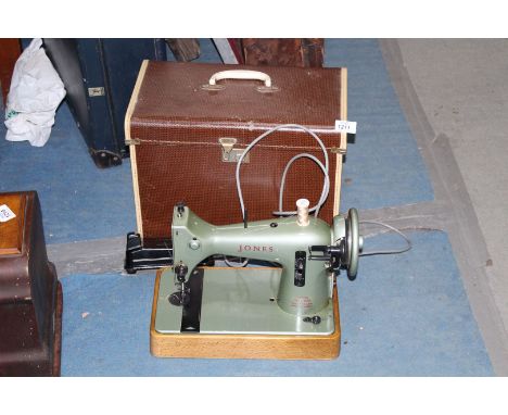 A vintage electric sewing machine 'CSE' made by Jones' sewing machine company, Manchester, cased.