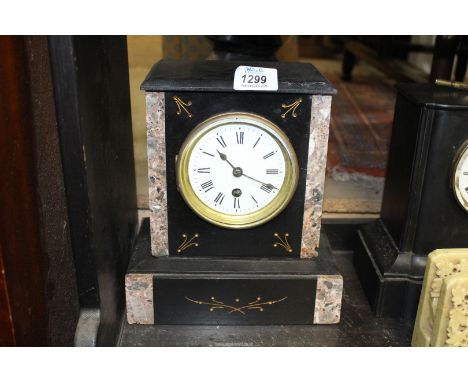 A slate and marble Mantle Clock having gold painted inset details, Roman numerals on a white face, key and pendulum present, 