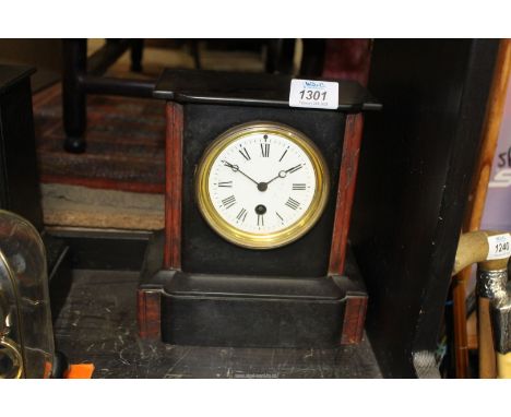 A slate and brown polished stone Mantle Clock having Roman numerals on a white face, back fixed, 8" wide x 8 3/4" high x 5" d