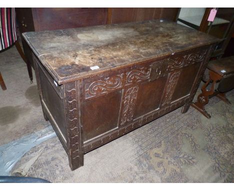 A peg-joyned three panel Oak Blanket Chest/Coffer having carved scroll and floral detail, 48 3/4'' x 21 7/8'' x 27 1/4'' high