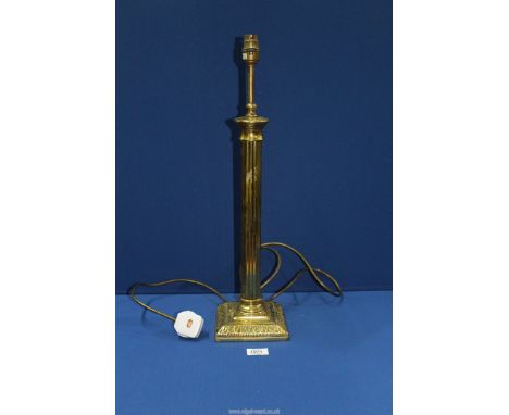 A brass effect Table Lamp with reeded column, 22'' tall.