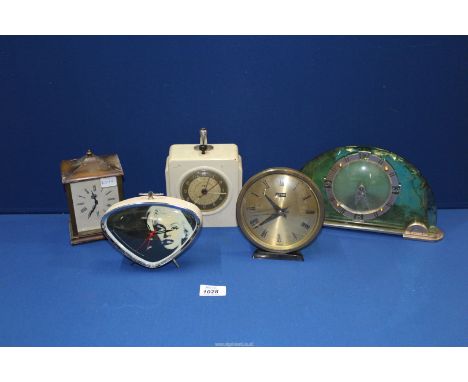 Five clocks to include; Marilyn Monroe alarm clock, Time master mantle clock with green glass foil back, wooden cased carriag